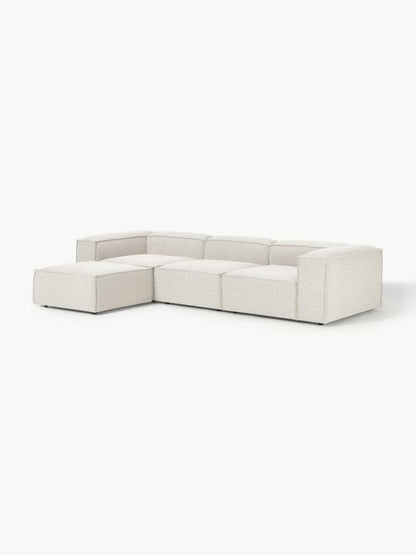 Canapé modulable 4 places en tissu bouclé avec pouf