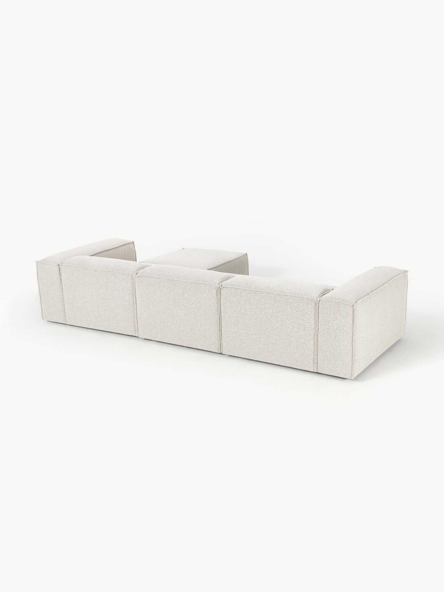 Canapé modulable 4 places en tissu bouclé avec pouf