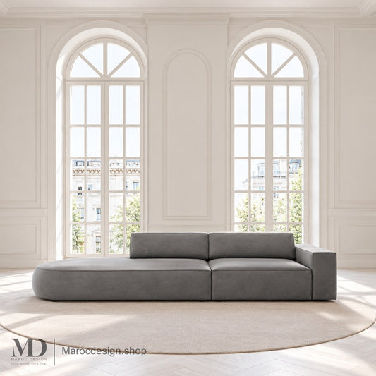 Canapé JODIE gris avec extrémité gauche arrondie en intérieur lumineux — Maroc Design