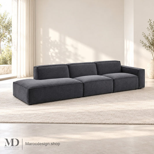 Canapé BOXTER anthracite avec extension à gauche de l’image en intérieur lumineux — Maroc Design