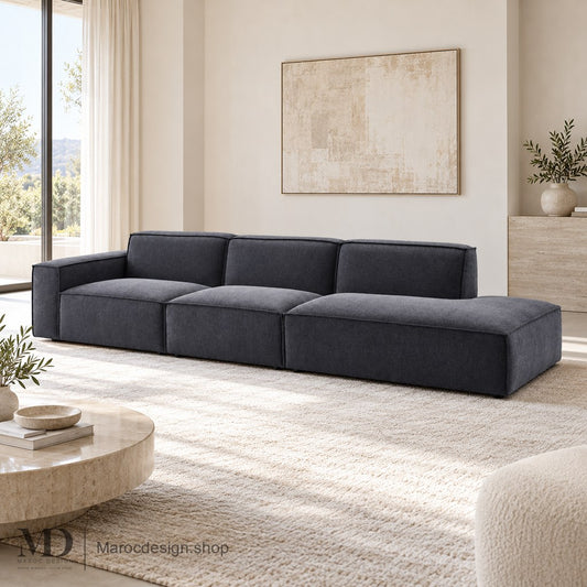 Canapé BOXTER anthracite avec extension à droite de l’image en intérieur lumineux — Maroc Design
