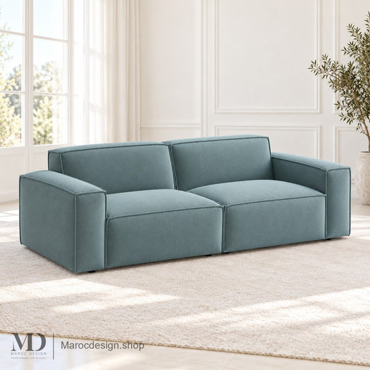 Canapé VERIDIAN bleu vert à deux assises et deux accoudoirs en intérieur lumineux — Maroc Design